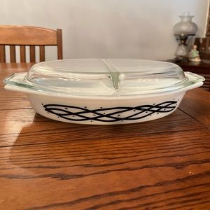 Vintage Pyrex white and black divided casserole serving bowl. In good shape.